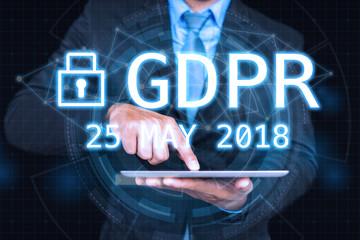 GDPR Concept,Businessman hand holding digital tablets sign general data protection regulation and key icon, Cyber security and information privacy,25 may 2018.