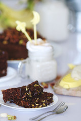 chocolate-pistachio cake served with cream