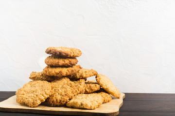 Lot of homemade oatmeal cookies on white background with copy space