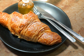 croissants with honey on plate close yummy