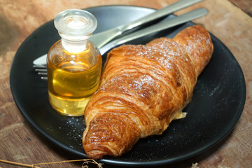 croissants with honey on plate close yummy