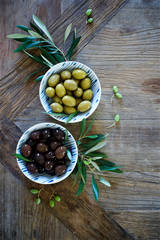 Mediterranean food background. Wooden table with olives