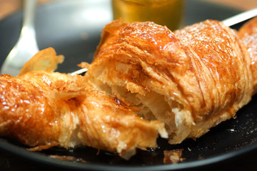 croissants with honey on plate close yummy