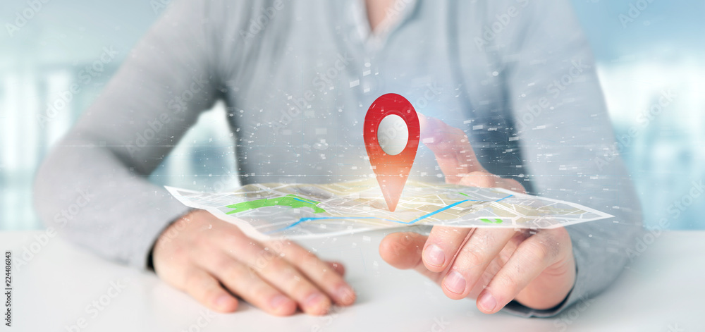 Aufkleber man holding a 3d rendering pin holder on a map