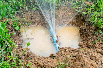 Water pipe break,leaking from hole in a hose  connection joint of plastic pipes Water supply...