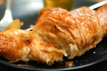 croissants with honey on plate close yummy