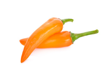 fresh orange chili with stem on white background