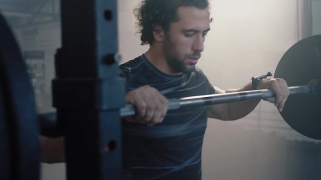 healthy man bodybuilder training using barbell weightlifting exercise muscular sportsman enjoying power lifting heavy weight in gym practice fitness lifestyle