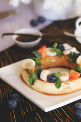 Coffee mousse served with fruits and berries