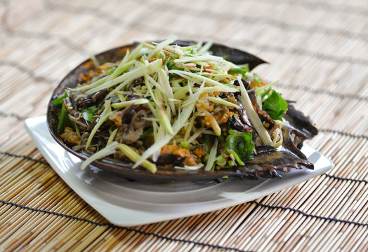 Egg spicy salad with Horseshoe crab with shallotsand mango ;Thai Food
