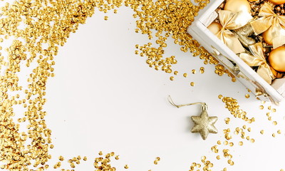 Christmas composition. Christmas golden decorations on white background. Flat lay, top view 