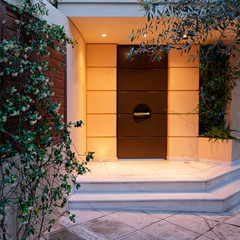 contemporary design house entrance dark brown door, illuminated