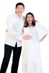 Portrait of happy man with his pregnant woman isolated over white background