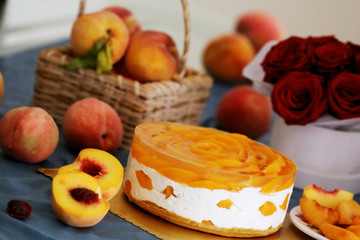 Peach mousse cake served with peaches