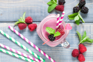 Delicious blackberry raspberry smoothie with mint and fresh berries in glasses. Selective focus. Top view