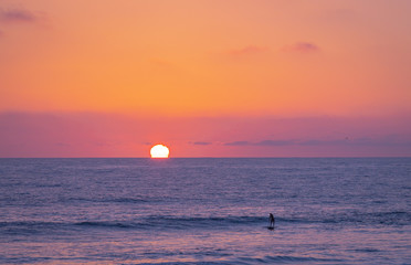 There is nothing quite so captive as watching the sun go down while strolling along the beach. Everybody seems to stop what they are doing to take in the beautiful colors of the sky and ocean waters 