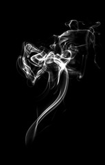 white smoke or dust, wavy and swirly on black background.  perfect for compositing eg. hot tea, cigarettes or other smoking things. 