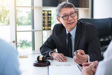 Unhappy divorce couple having conflict, husband and wife during divorce process with senior male...
