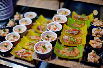 buffet food, catering food party at restaurant, mini canapes, snacks and appetizers