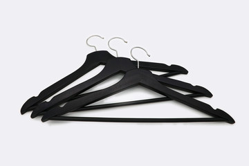black clothes hangers on white background, isolated
