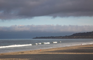 Early morning while on summer family vacation at the beach is a great time to walk along the shoreline and take in the fresh air and seas side sounds. Relaxing