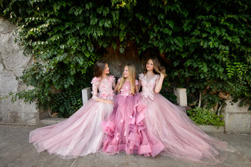 Beautiful girls in amazing dress outdoor. Children bridesmaids