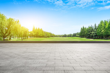 Empty city square floor and green woods scenery
