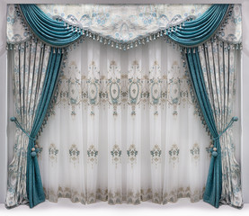 Interior design in a classical style. Decorating the window with curtains made of tapestry fabric, lambreken and translucent tulle with ornament © fotiy