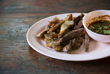 Roasted beef slice serve with spicy and sour sauce, Barbecue thai style. image for background, wallpaper and copy space