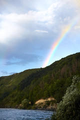 Rainbow. Rainbow in the sky above mountain and the river.Landscape