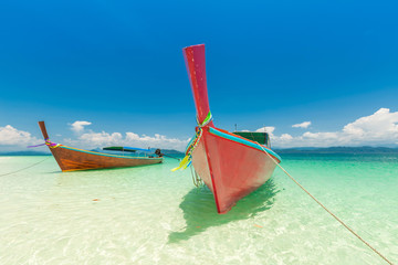 White sand beach and Long-tail boat at Khang Khao Island (Bat island), The beautiful sea Ranong Province, Thailand.