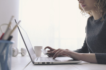 Woman doing online shopping with a credit card