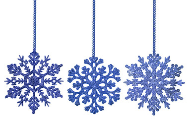 three blue snowflake shape decorations on chains