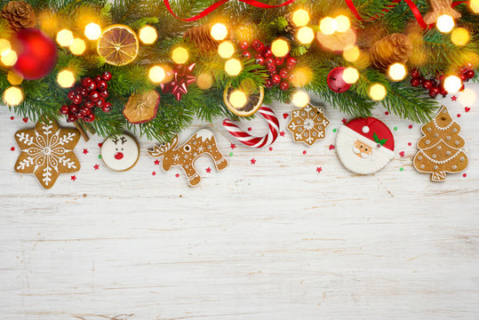 Glittered Christmas background, decorated holiday tree branches and copy space