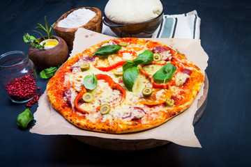 Delicious fresh pizza on dark