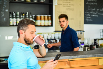 Have sip of energy. Man client with beard enjoy coffee in paper cup. Drinks to go useful option in...