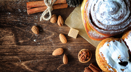 Pie with cinnamon and apples on a wooden table. Fresh pastry wit