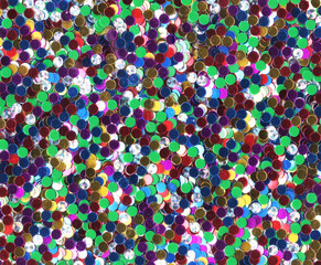 Naklejka premium Multicolored colorful glitter background sparkling shiny wrapping paper texture for Christmas holiday seasonal wallpaper decoration, Valentines greeting and wedding invitation card design element.