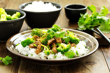 Beef with broccoli and rice. Asian cuisine.