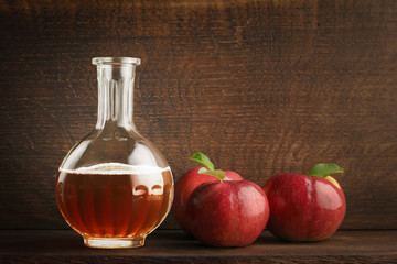Apple cider vinegar in a glass decanter. Сopy space.