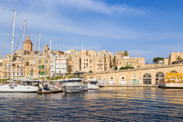 Fototapeta na wymiar Birgu (Vittoriosa), Malta. Boat port and Embankment
