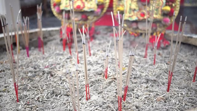 Burning incense sticks with smoke at Chinese traditional temple - Buddhism temple
