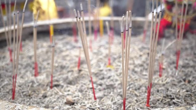 Burning incense sticks with smoke at Chinese traditional temple - Buddhism temple