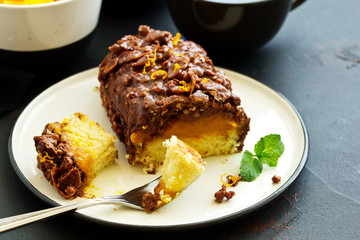 Almond-orange cupcake in chocolate glaze.