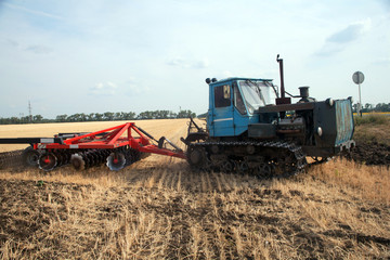 Tractor preparing land for sowing