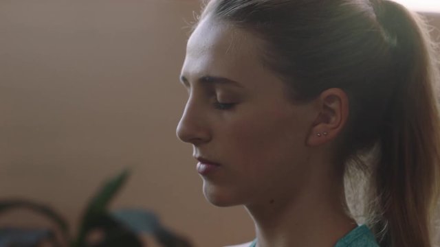 young business woman practice yoga meditation in office enjoying mindfulness exercise relaxing on lunch break close up