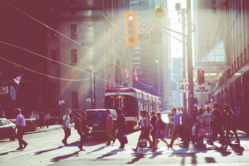 Rush hour atToronto's busiest intersections. Financial district at the background. - obrazy, fototapety, plakaty