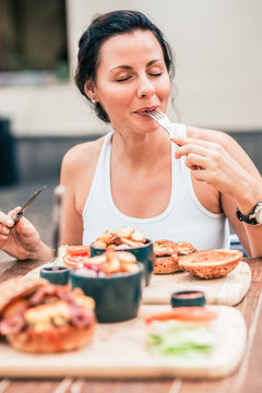 Young Woman Eating Delicious Meal.