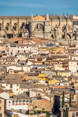 Naklejka premium Early morning Cityscape. Aerial view of the ol city of Toledo, Spain. Cathedral in the background. UNESCO world heritage site.