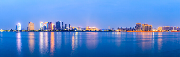 Fototapeta na wymiar Modern city buildings scenery and rivers in Hangzhou at night